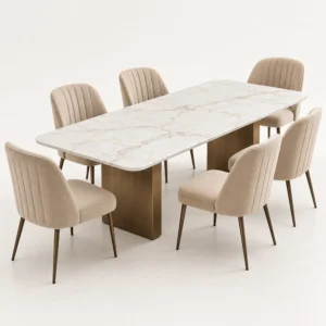 White marble-look rectangular dining table with bronze-tone bases and six beige upholstered chairs.